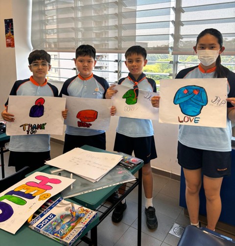 P5 students preparing to teach the P2 juniors about sign language